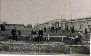 Taking in the air outside the barracks. Franz Stock is the priest seated in the middle of the picture. Source: H. Briand and Les Amis de Franz Stock; used with permission.